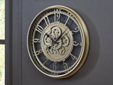 Best Furniture Outlet - Ashley Furniture - Gilover Wall Decor - Wall Clock / Champagne Finish - A8010386