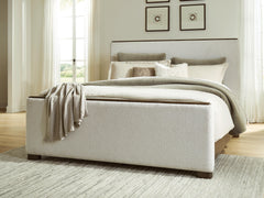 Best Furniture Outlet - Ashley Furniture - Radkin Bedroom - King Upholstered Panel Bed / Burnished Brown - PCB843B4