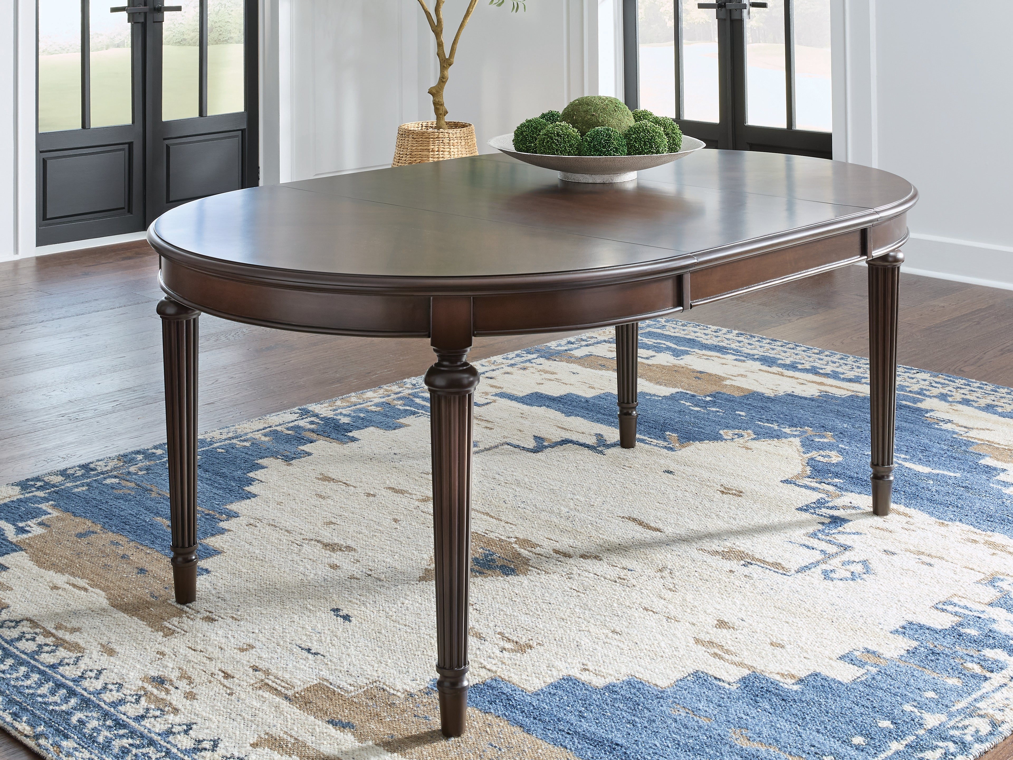 Best Furniture Outlet - Ashley Furniture - Lavinton Dining Room - Oval Dining Room EXT Table / Brown - D764-35