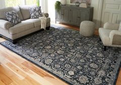 Best Furniture Outlet - Ashley Furniture - Hilcott Rug - 7'10" x 10'6" Rug / Blue/Cream/Brown - R406111