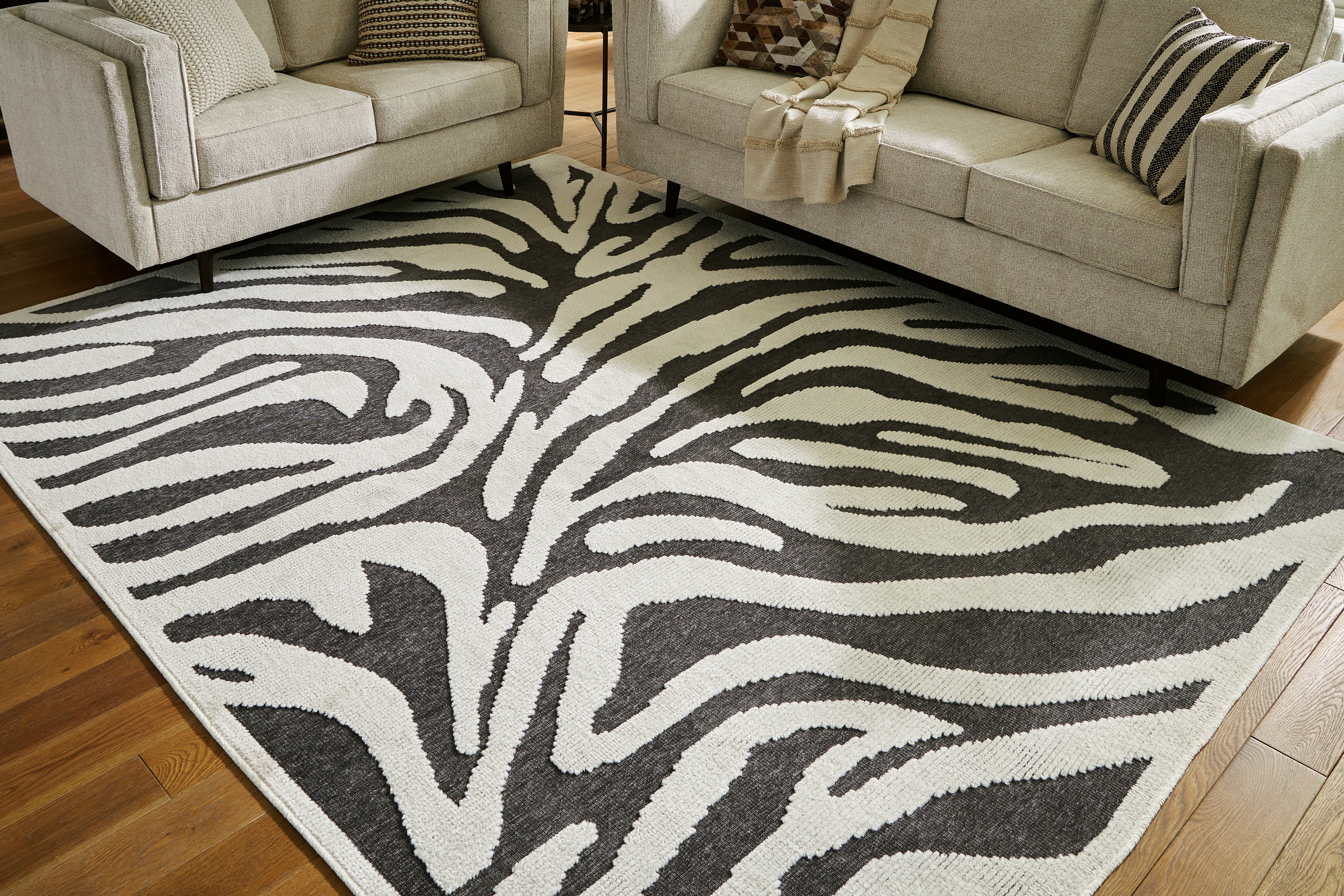 Best Furniture Outlet - Ashley Furniture - Thomwith Rug - 8' x 10'2" Washable Rug / Black/Ivory - R406291