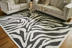 Best Furniture Outlet - Ashley Furniture - Thomwith Rug - 8' x 10'2" Washable Rug / Black/Ivory - R406291