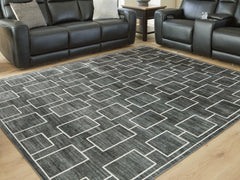 Best Furniture Outlet - Ashley Furniture - Elderland Rug - Washable 7'6" x 9'6" Area Rug / Black/Gray - R407401