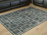 Best Furniture Outlet - Ashley Furniture - Elderland Rug - Washable 7'6" x 9'6" Area Rug / Black/Gray - R407401
