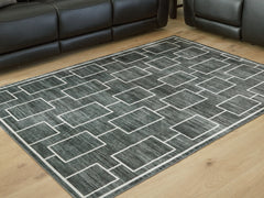 Best Furniture Outlet - Ashley Furniture - Elderland Rug - Washable 7'6" x 9'6" Area Rug / Black/Gray - R407401