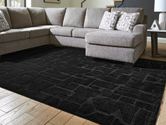 Best Furniture Outlet - Ashley Furniture - Gibbswell Rug - Washable 8' x 10' Area Rug / Black - R407461