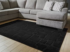 Best Furniture Outlet - Ashley Furniture - Gibbswell Rug - Washable 5' x 7' Area Rug / Black - R407462