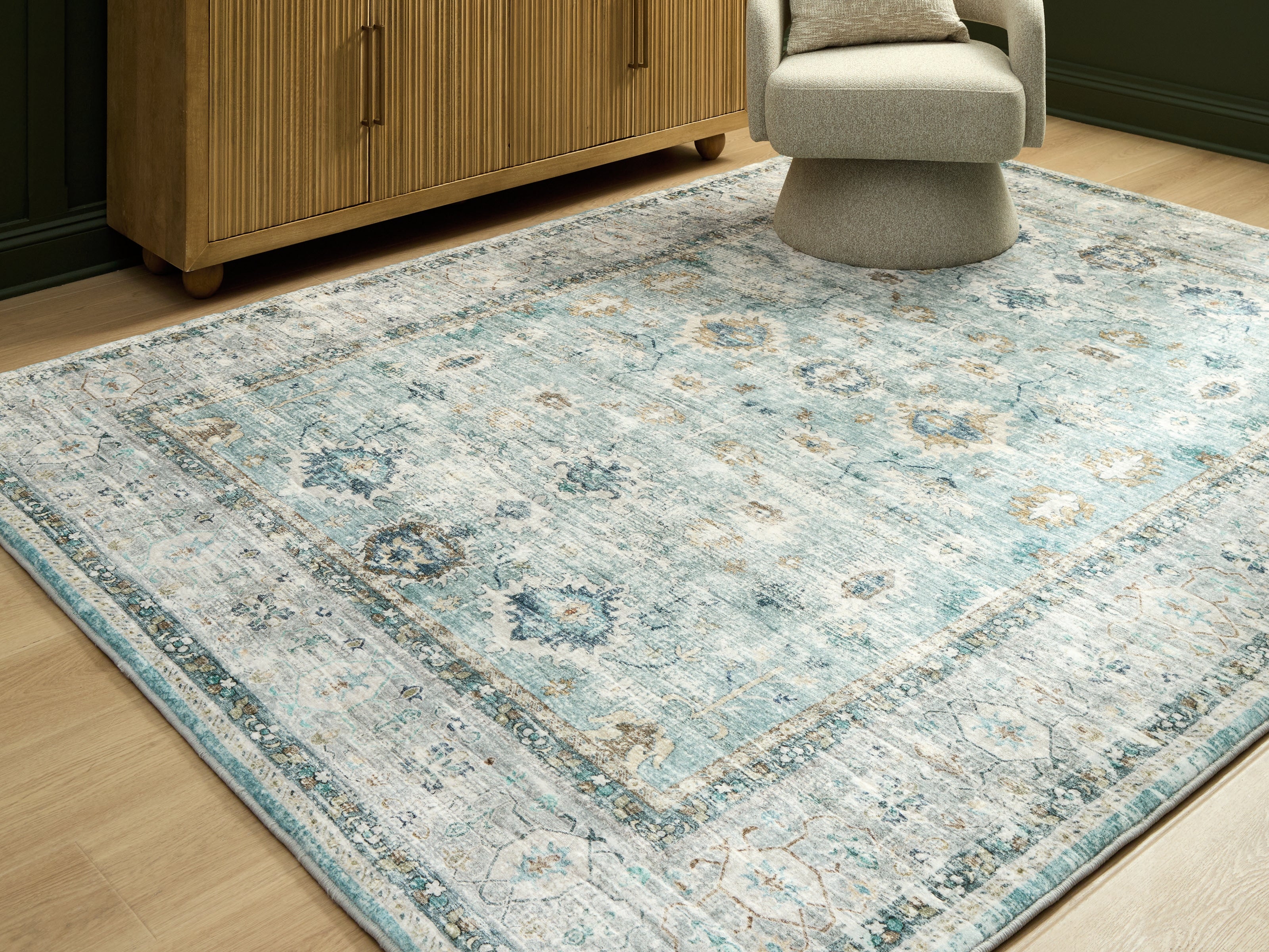 Best Furniture Outlet - Ashley Furniture - Ladstoney Rug - 7'6" x 9'6" Area Rug / Teal/Beige/Ochre - R407501