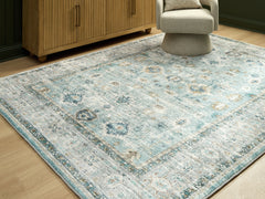 Best Furniture Outlet - Ashley Furniture - Ladstoney Rug - 7'6" x 9'6" Area Rug / Teal/Beige/Ochre - R407501