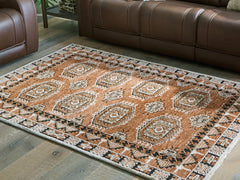 Best Furniture Outlet - Ashley Furniture - Qaabiz Rug - 5' x 7' Area Rug / Sienna/Ivory/Black - R407522