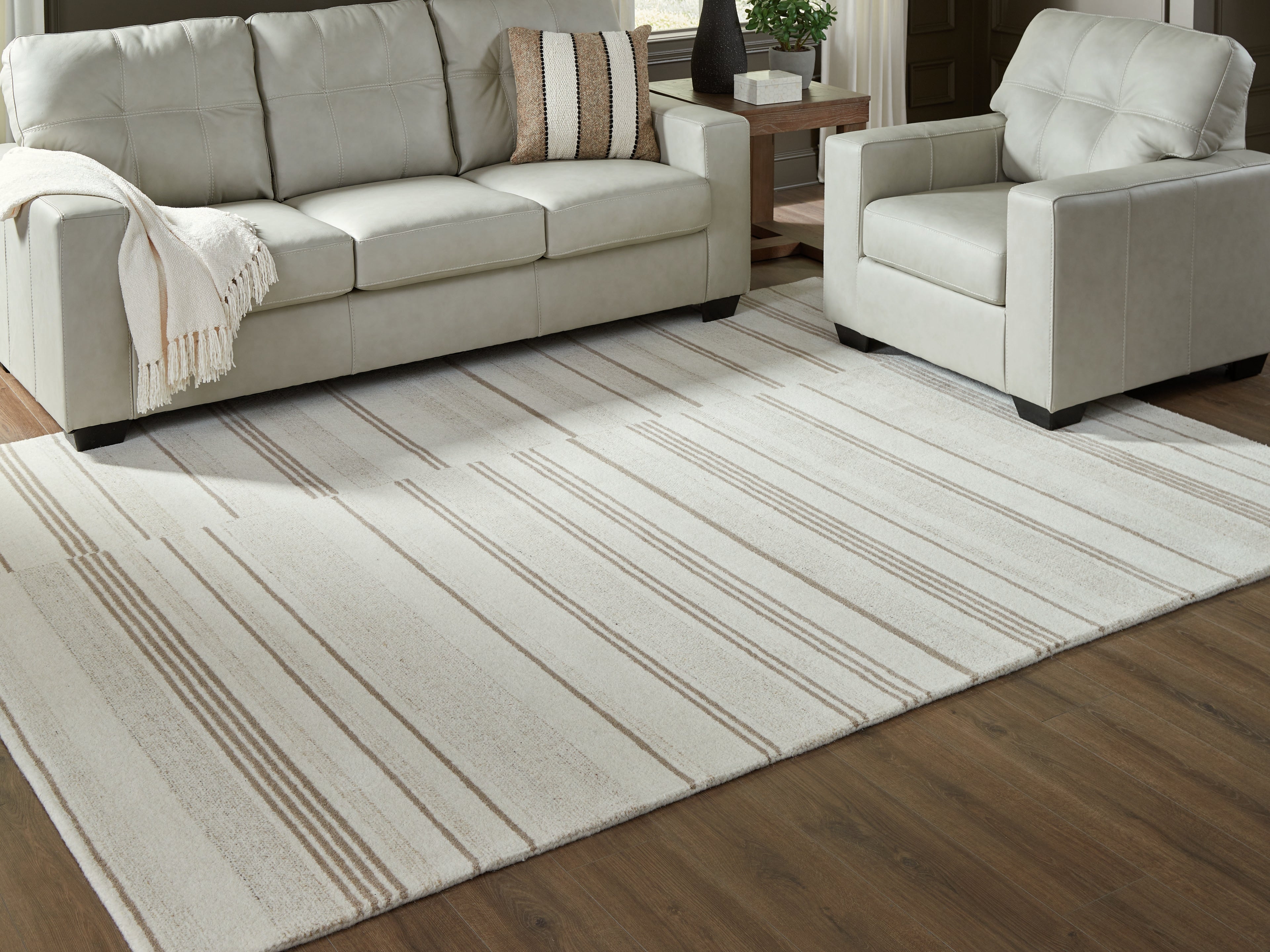 Best Furniture Outlet - Ashley Furniture - Gadence Rug - 7'8" x 10' Area Rug / Ivory/Tan - R407641