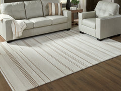 Best Furniture Outlet - Ashley Furniture - Gadence Rug - 7'8" x 10' Area Rug / Ivory/Tan - R407641