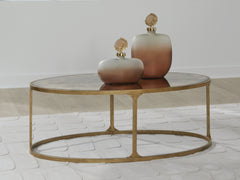 Best Furniture Outlet - Ashley Furniture - Korajane Coffee Table - Oval Cocktail Table / Antique Gold - T399-0