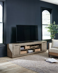 Best Furniture Outlet - Ashley Furniture - Krystanza 92" TV Stand - 92" / Weathered Gray - W760-78